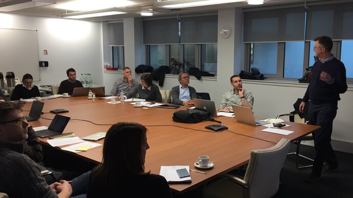 Workshop delegates discussing around a table