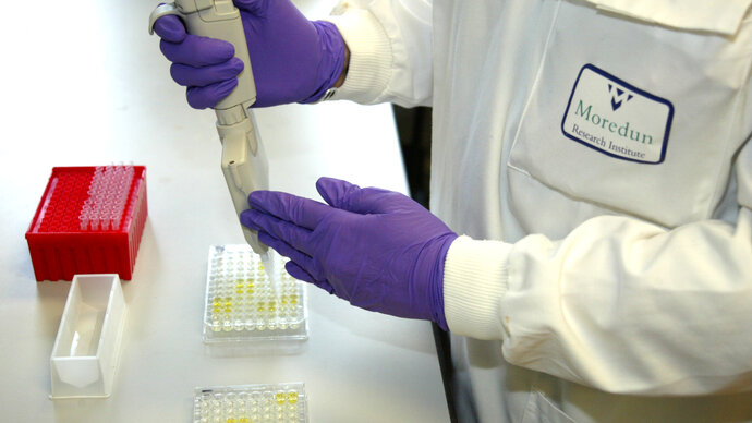 Moredun Research Institute scientist pipetting