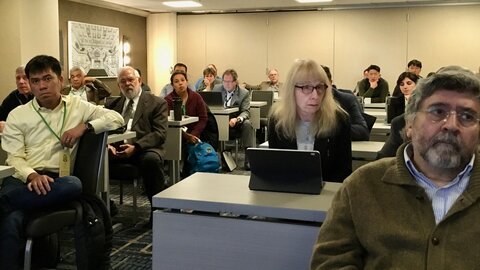 Participants at the inaugural USAVRCN meeting held in Chicago, Illinois Photo of a group of people listening to a seminar