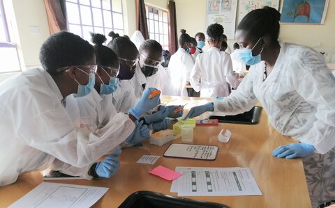 Students at St Loise Girls Secondary School practise micro pipetting as part of the workshop