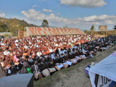 Students listening to a speaker