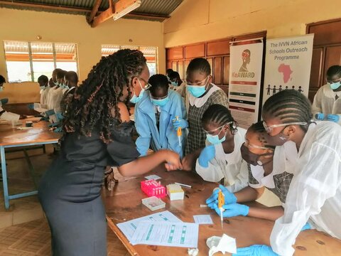 Celestine Makokha taking some students of Mwakitawa girls through one of the sessions A scientist talking to students in a classroom