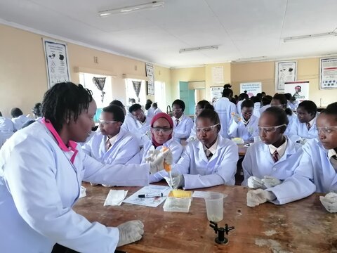 Ms. Susan Kabacia assisting the students during the experiment.