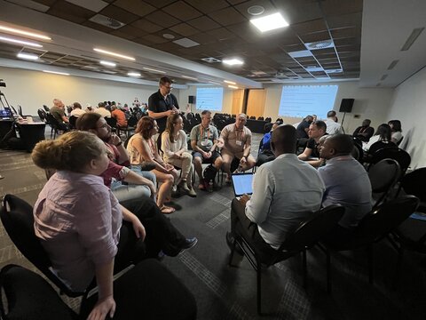Group discussions where the participants are exploring the challenges presented by the ECRs and brainstorming potential solutions.