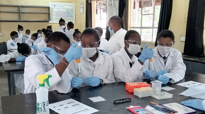 Students at Naivasha Girls Secondary School using pipettes as part of an outreach workshop